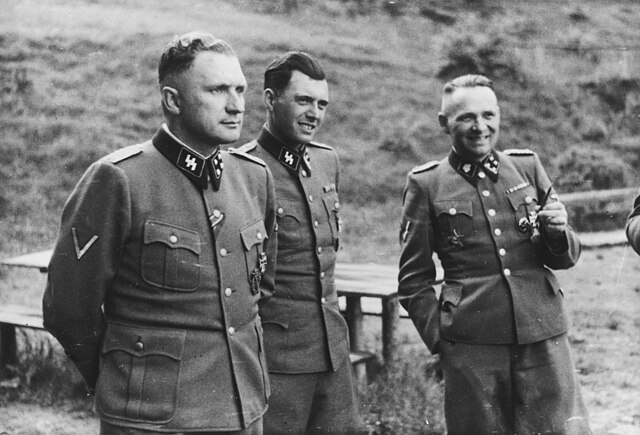 Three men in army uniforms.